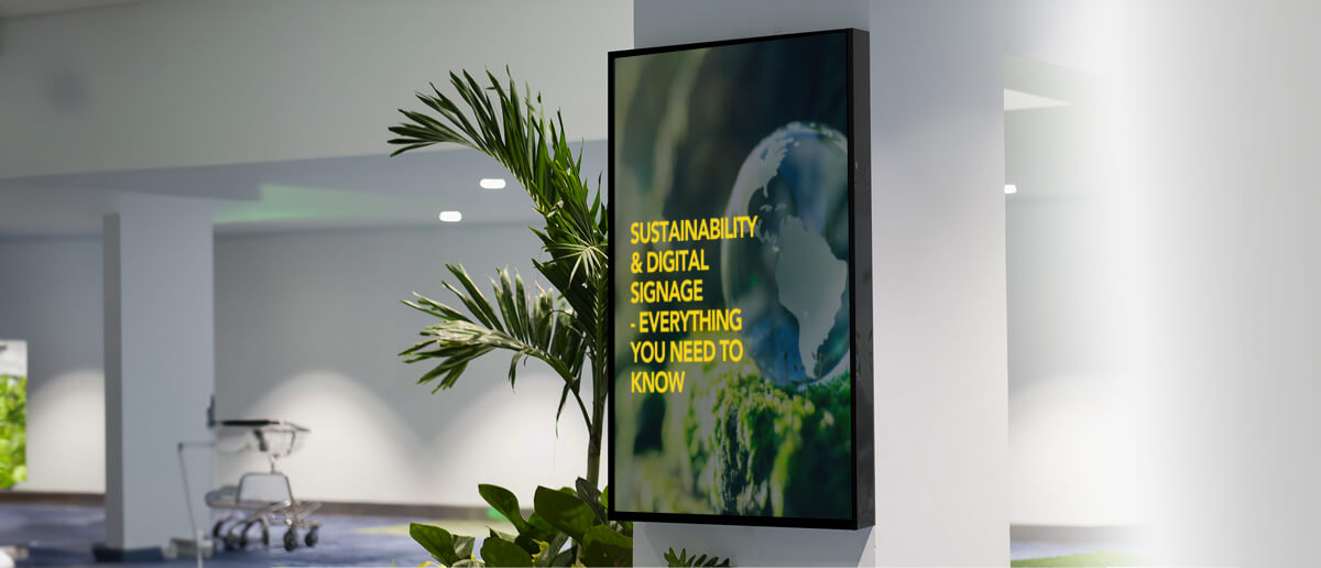  Digital signage displaying eco-friendly messages and green energy symbols, promoting sustainability in using digital signage