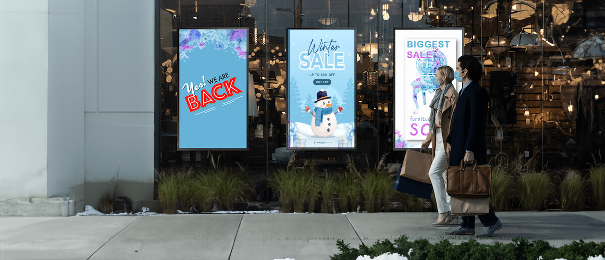 Digital signage screens used for showing winter fashion trends.