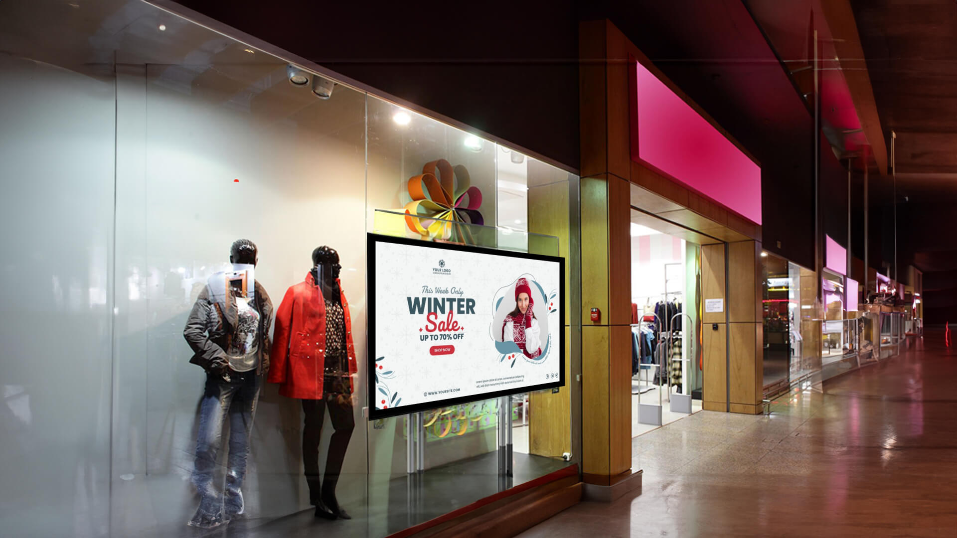 Digital signage screens used for showing winter fashion discounts outside stores.